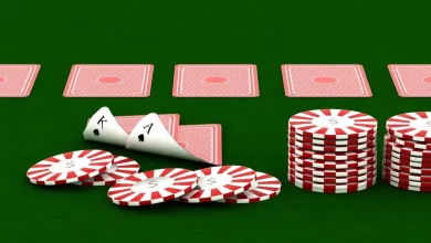 a poker chips and cards on a green table