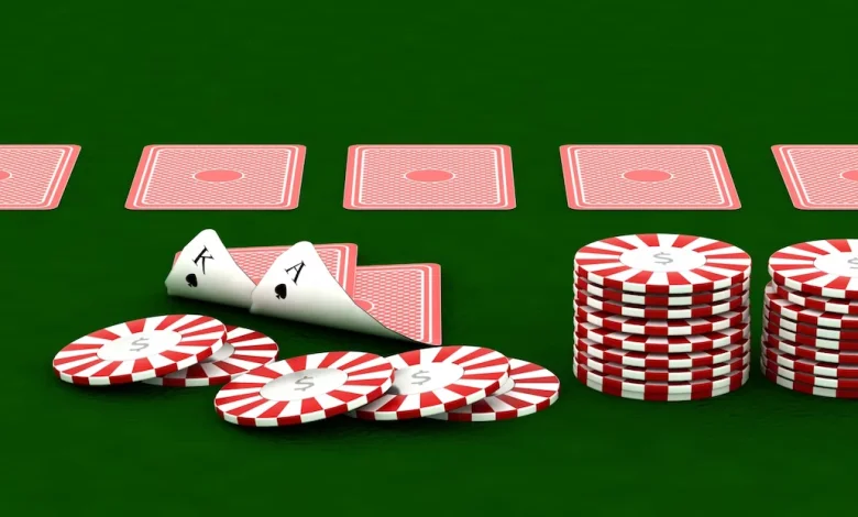 a poker chips and cards on a green table